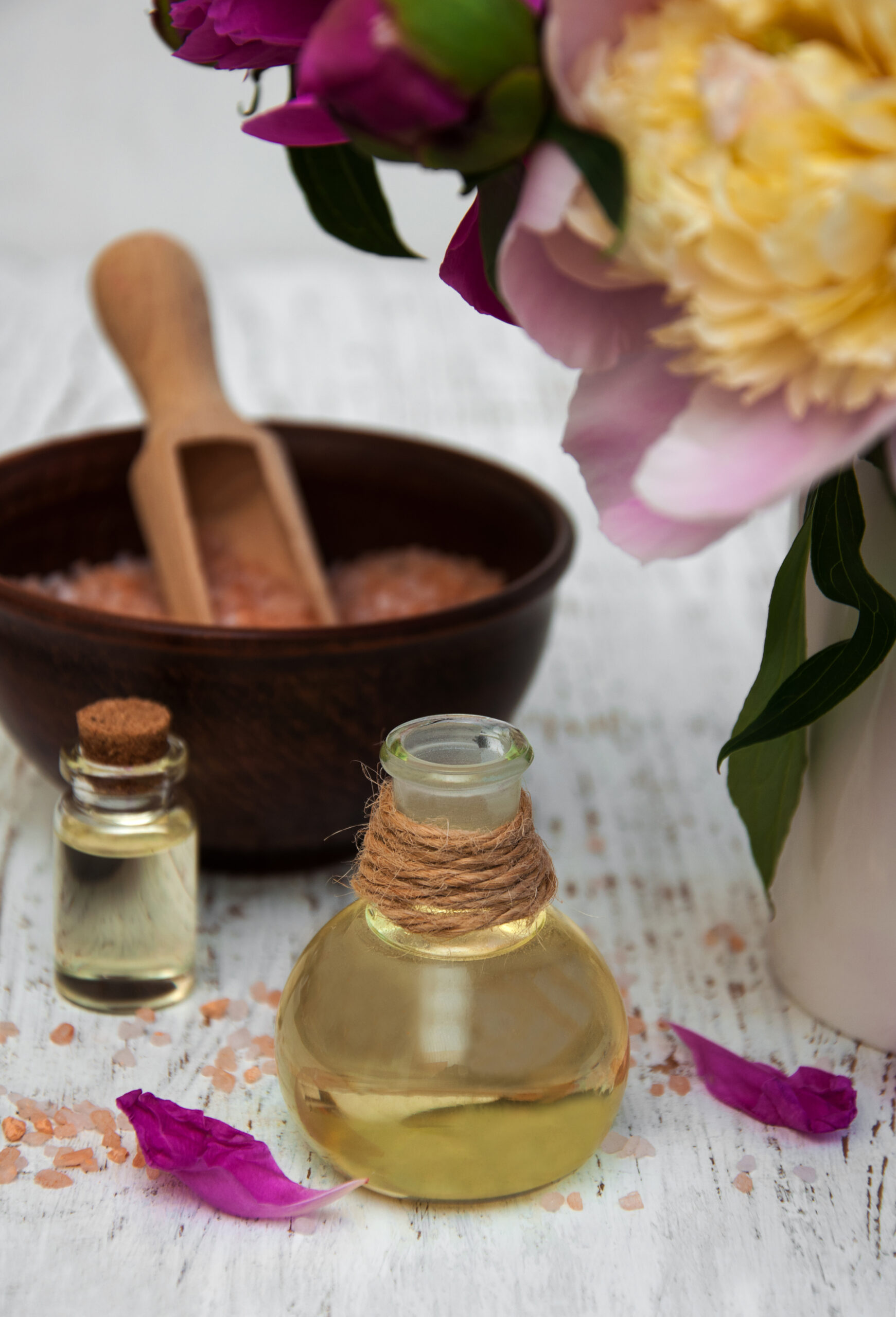Peony flowers, massage oils and salt